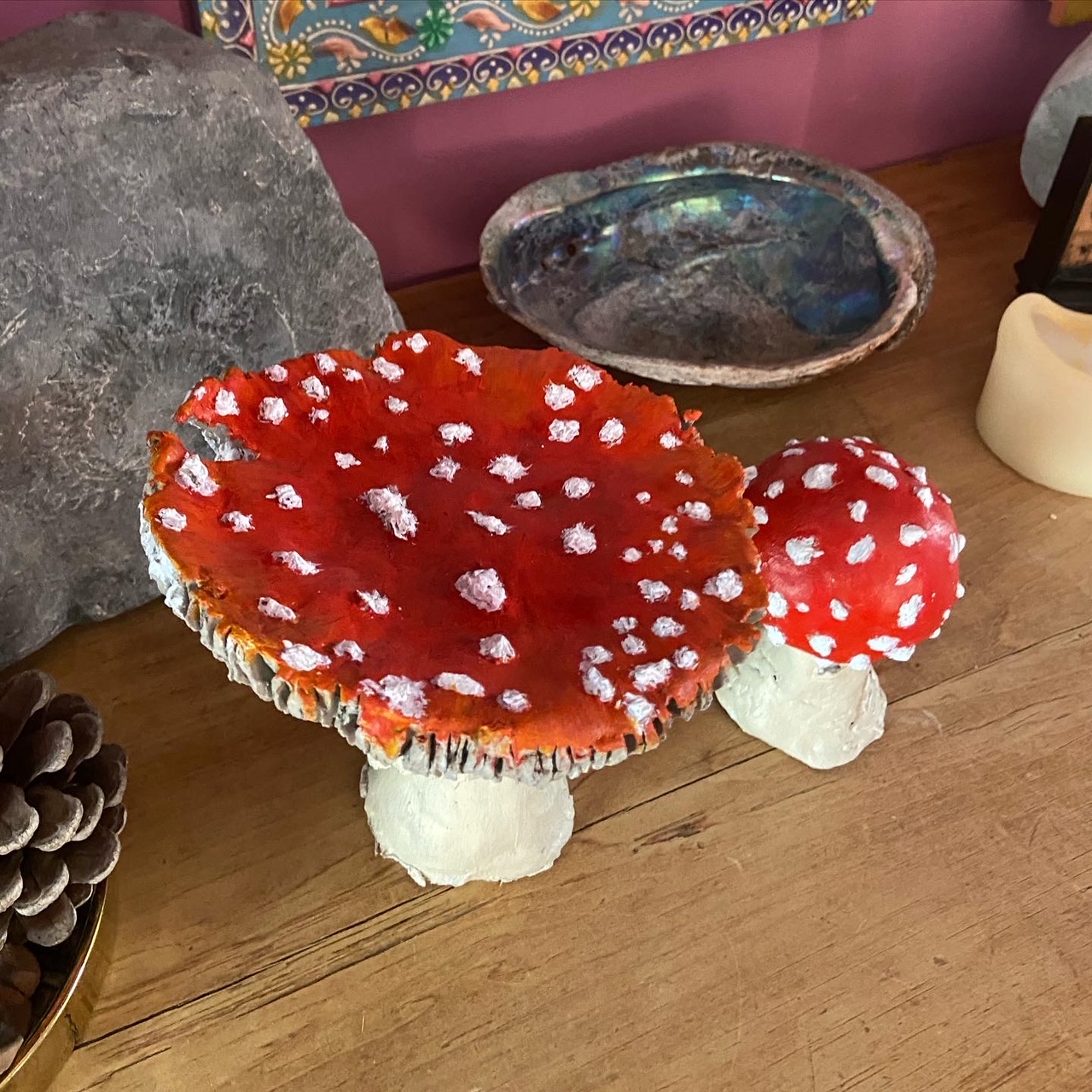 Photo of two clay painted Fly Agaric mushrooms by Betty Adamou